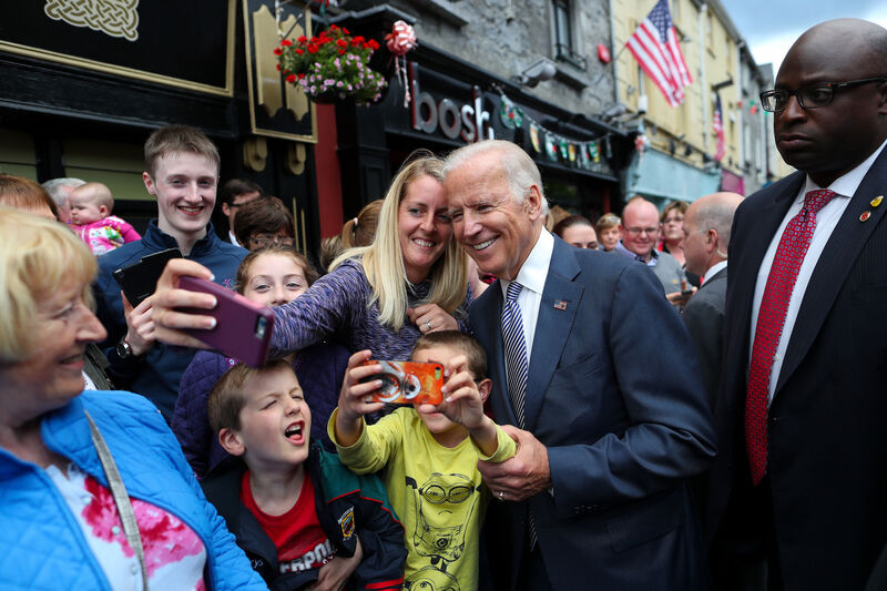 Handout photo issued by Maxwell's Photography of US Vice President Joe Biden (centre) posing for a selfie as he meets people in Castlebar, Co. Mayo, during his visit to Ireland in 2016. Handout photo issued by Maxwell's Photography of US Vice President Joe Biden (centre) posing for a selfie as he meets people in Castlebar, Co. Mayo, during his visit to Ireland in 2016.