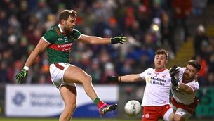 <p>Aidan O'Shea of Mayo scores his side's first goal against Tyrone despite the attentions of Cormac Monroe and Padraig Hampsey. Picture: Ben McShane/Sportsfile</p>
