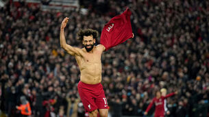 <p>TOPS OFF: Liverpool's Mohamed Salah celebrates scoring his side's sixth goal. Picture: Peter Byrne/PA Wire</p>