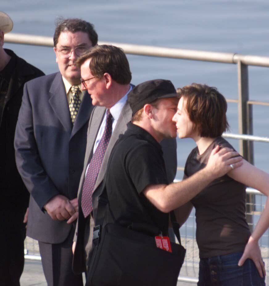 Pop star Bono greets Charlotte Hatherley, then of Northern rockers Ash, before the start of a concert in Belfast in support of the Good Friday Agreement in May of 1998 - having just released second LP 'Nu-Clear Sounds'. In the background are (l/r) SDLP leader, John Hume and Ulster Unionist leader David Trimble). Photo by Chris Bacon/PA.
