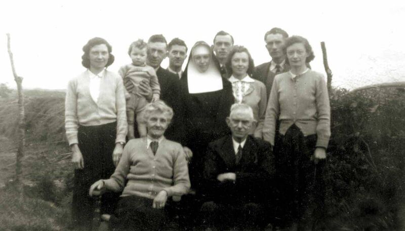 Ellen Collins (Connolly) with her husband Jeremiah Collins (front row). They are with family members and their spouses, including Kathleen Collins (far left), Diarmuid O'Mahony (baby), and Edward O'Mahony (third from left).