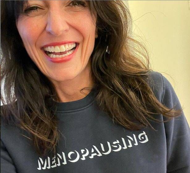 Davina McCall wears a 'menopausing' slogan sweater Davina McCall wears a 'menopausing' slogan sweater