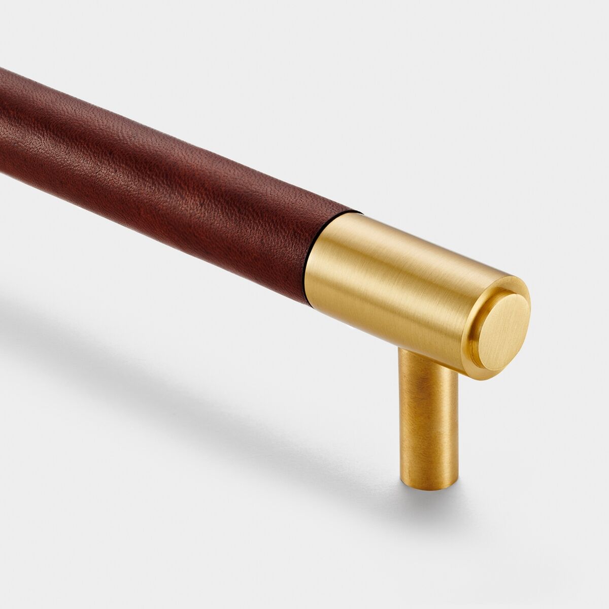 Rich conker tones teamed with gold are trending for pulls and more. Vegí tanned leather handles, €67 each, pushkahome.com.