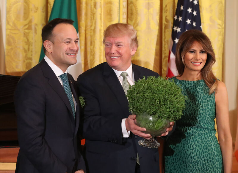 Irish Taoiseach Leo Varadkar presents US President Donald Trump with a bowl of shamrock as Melania Trump looks on during the 2018 annual presentation ceremony at the White House in Washington DC, USA. Irish Taoiseach Leo Varadkar presents US President Donald Trump with a bowl of shamrock as Melania Trump looks on during the 2018 annual presentation ceremony at the White House in Washington DC, USA.