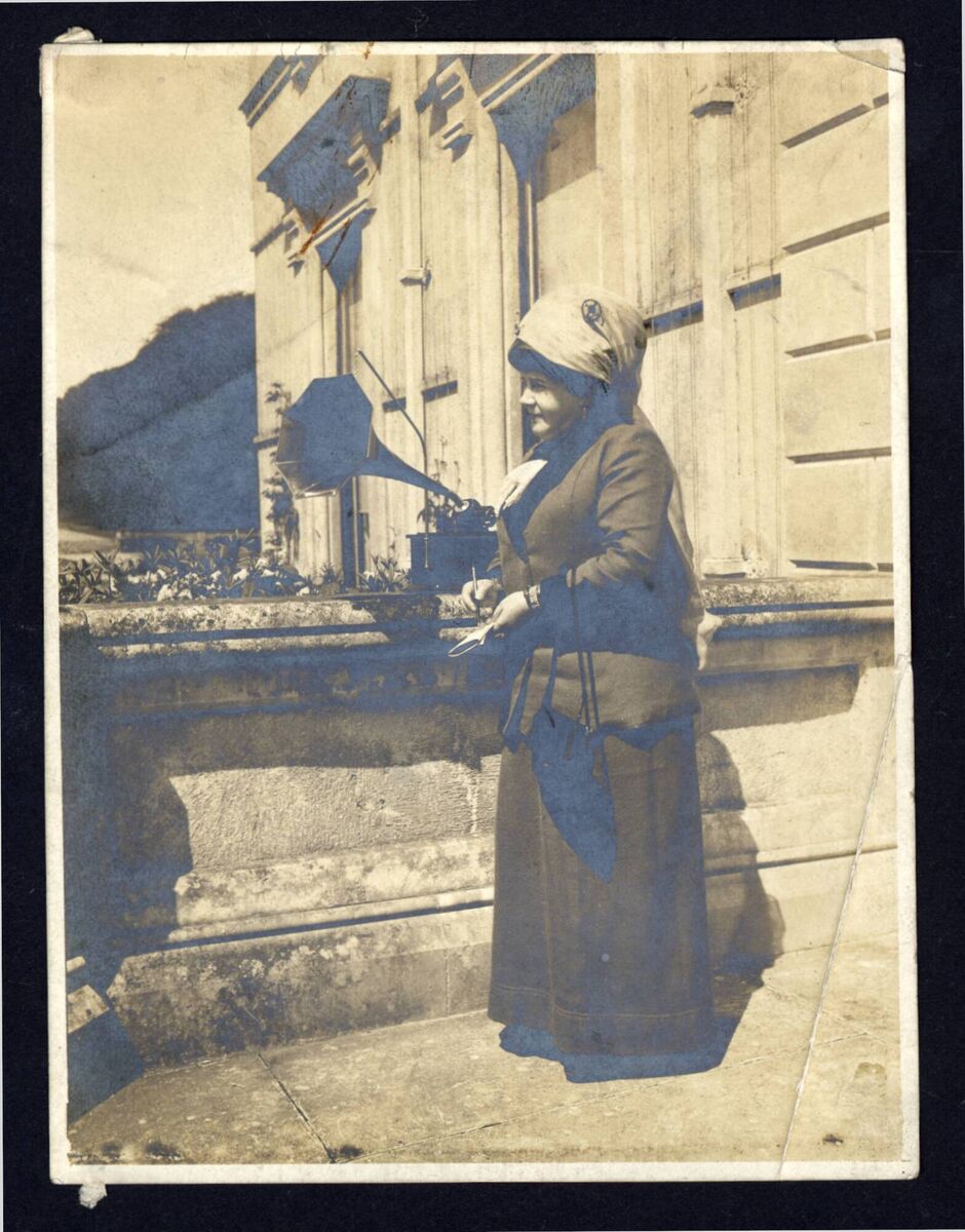 Charlotte Milligan Fox using the latest media technology, the phonograph, to record a fiddler at Curraghmore estate in Co Waterford in the early part of the 20th century. 	File picture: QUB