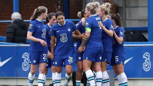 <p>MATCHWINNER: Sam Kerr, centre, scored at Kingsmeadow. Pic: Steven Paston/PA</p>