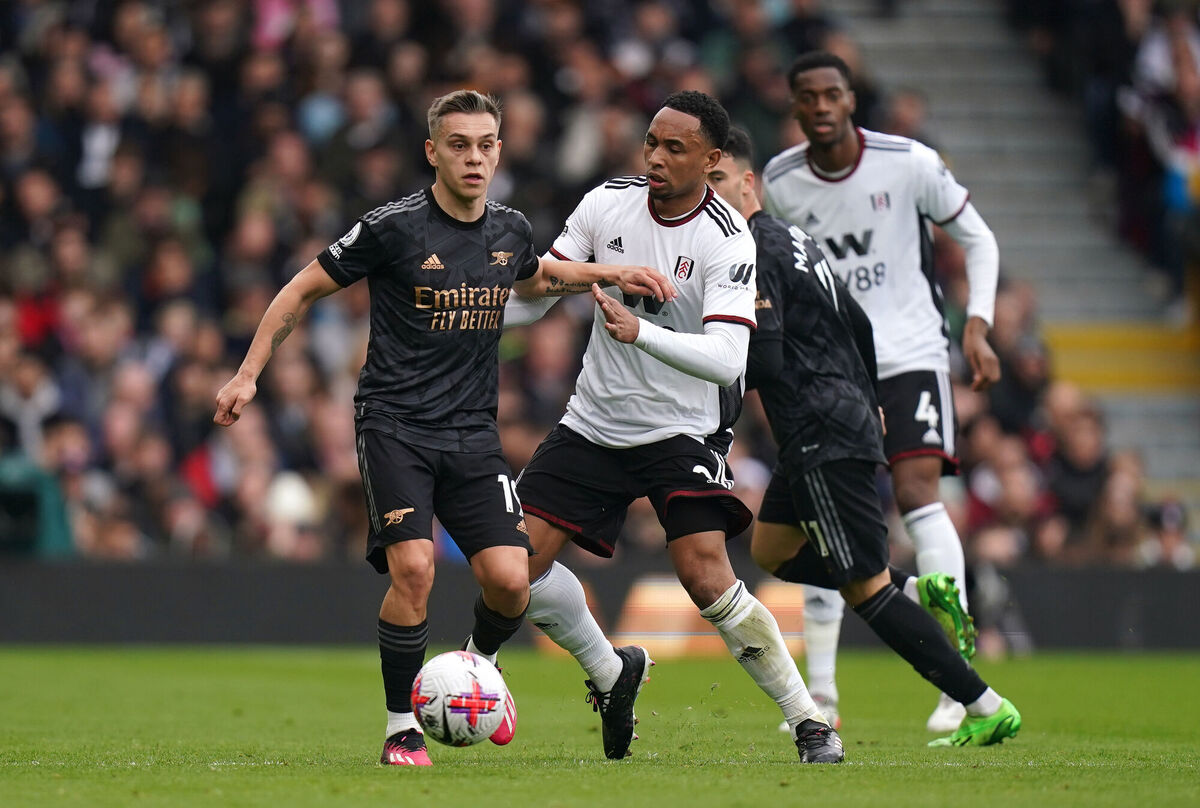 HAT-TRICK OF SORTS: Arsenal's Leandro Trossard (left) and Fulham's Kenny Tete battle for the ball. Pic: Adam Davy/PA Wire