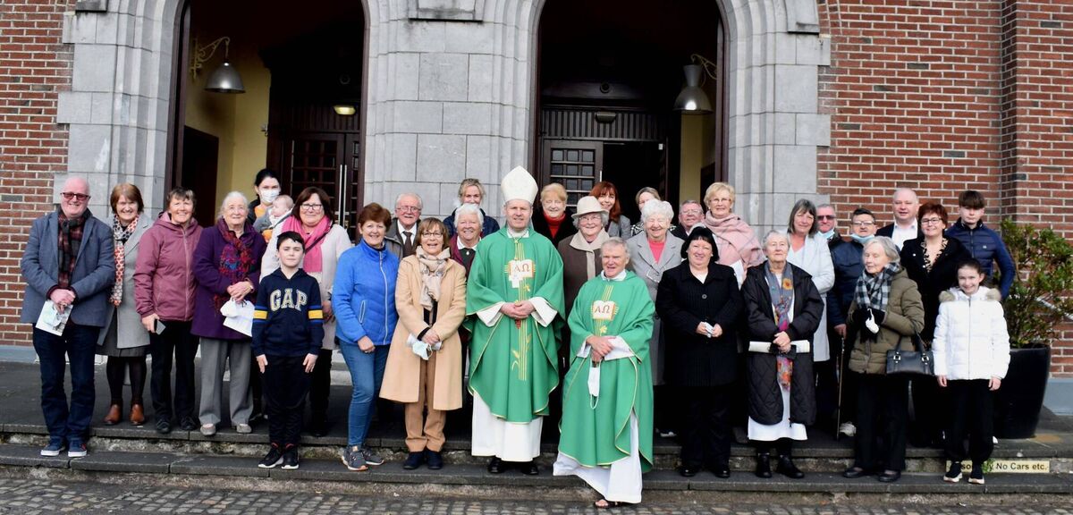 Bishop Fintan Gavin and Canon Michael Murphy PP with some parishioners following Mass celebrated by the Bishop on his first visit to the Church of the Assumption, Ballyphehane. Picture: Mike English