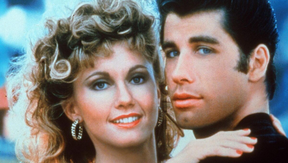 Actors John Travolta and Olivia Newton-John embrace in a promotional still for the film, 'Grease,' directed by Randal Kleiser, 1978. Pic: Paramount Pictures/Fotos International/Getty Images