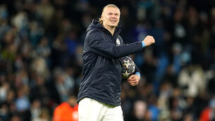 <p>Erling Haaland celebrates with the match ball following his five goals against RB Leipzig (Martin Rickett/PA)</p>