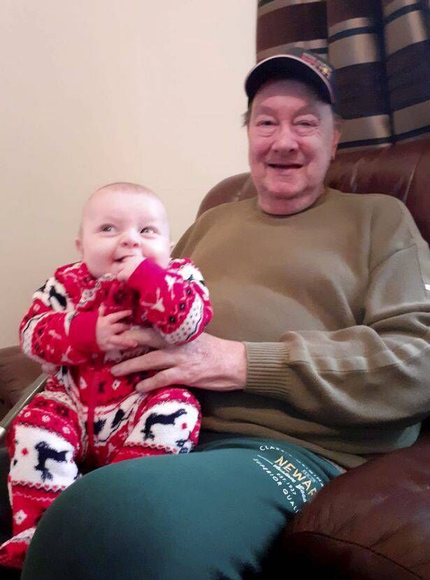 Jasper Kraus with one of his granddaughters. Jasper Kraus with one of his granddaughters.