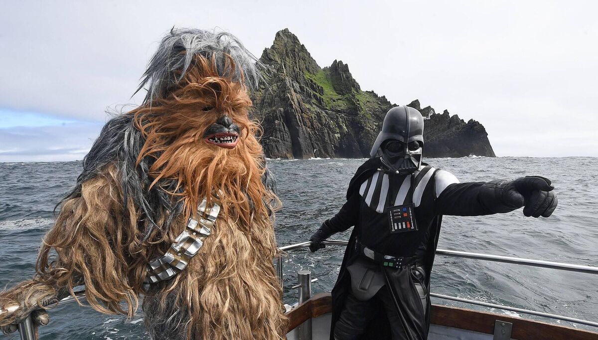 Fans in Star Wars costume visiting Skellig Michael which was featured in two of the hit series' movies. 