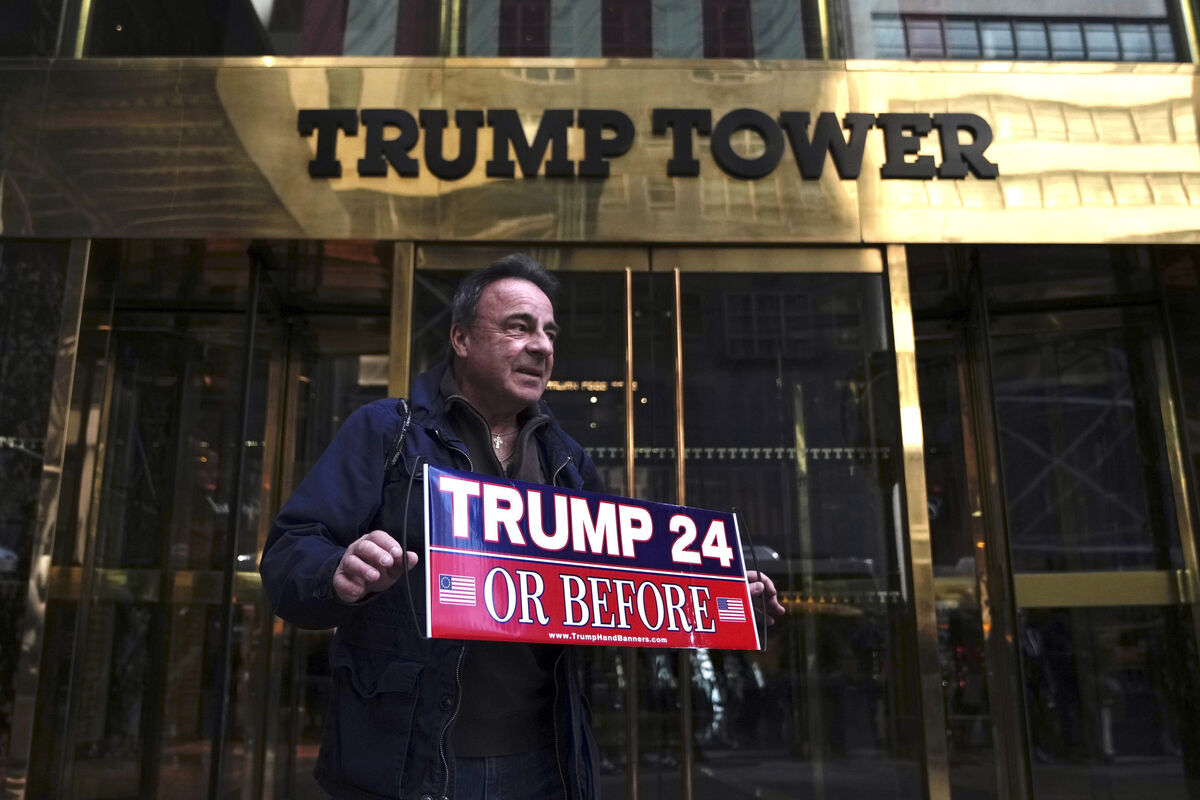 Jeffrey Shinko, of Lucerne County, Pa, holds a sign while standing in front Trump Tower on Tuesday, March 21, 2023, in New York. Picture: AP Photo/Bryan Woolston