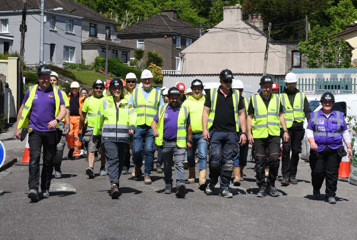 The purple shirts and team of volunteers who worked on the home of Adam Drummond. Picture: Denis Minihane