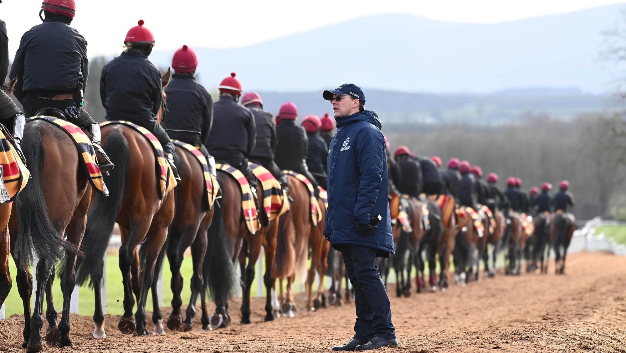 IN COMMAND: Aidan O'Brien talks tactics with his work riders ahead of the horses' morning exercise on the famous Ballydoyle gallops. Pic: Healy Racing