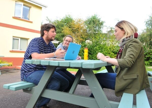 Project worker Jess Feehan chats with third level students Matthew Moynihan and Katelyn Kelly at the Bishopsgrove supported student accommodation in the Curraheen estate, Co Cork.