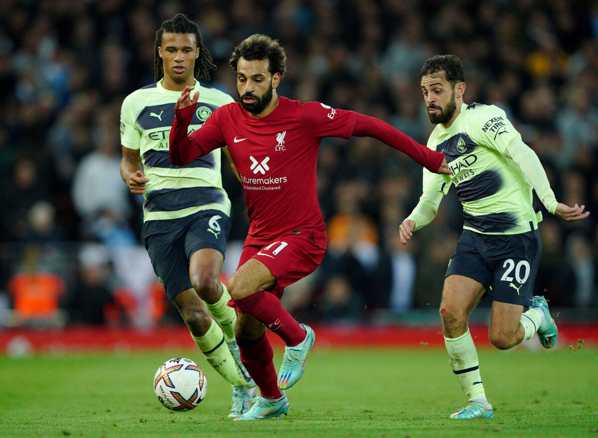 VITAL IMPACT: Liverpool's Mohamed Salah gets past Manchester City's Nathan Ake and Bernardo Silva during the Premier League match at Anfield. Pic:: Peter Byrne/PA Wire.