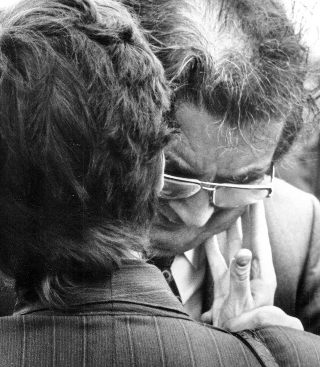 SDLP leader John Hume is comforted as he weeps at the funerals of the Greysteel massacre victims.