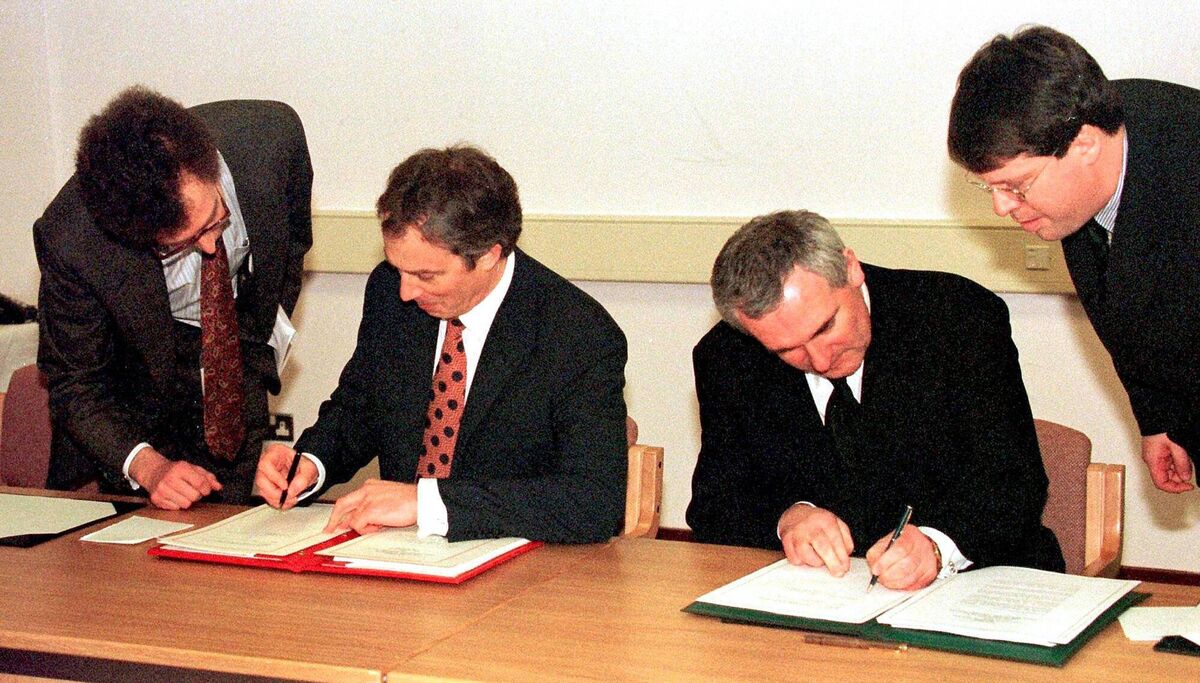 Tony Blair (centre, left) and Bertie Ahern signing The Good Friday Agreement. Picture: Dan Chung/PA Wire