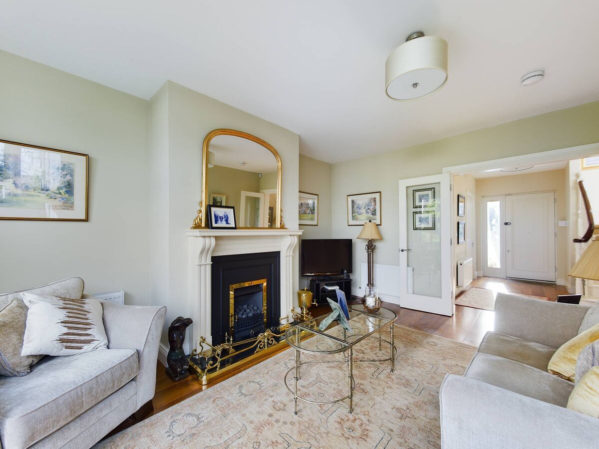 Living room with double doors to the hallway