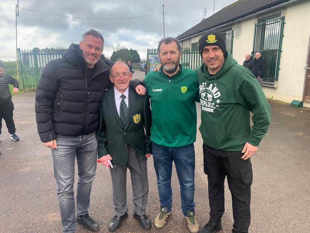 CARRA IN CORK: Liverpool legend Jamie Carragher and former Manchester United captain Gary Neville with Rockmount AFC members.