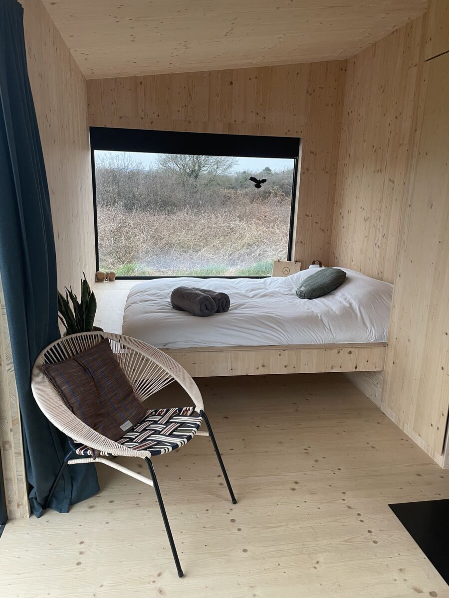 A picture-frame window gives you a look out onto the Burren from your bed.