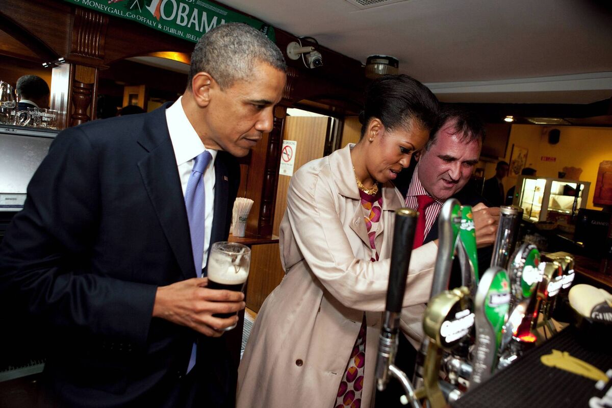Barack Obama looks on as Michelle Obama pulls a pint of stout at Ollie Hayes' pub in Moneygall on the Offaly-Tipperary border in May, 2011. File picture: Pete Souza/White House/Getty