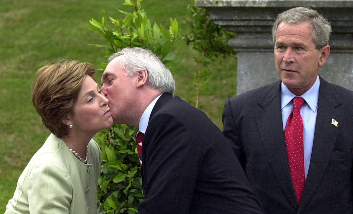 Then taoiseach Bertie Ahern greeting US first lady Laura Bush as US president George W Bush looks on after they arrived at Dromoland Castle in Co Clare for the EU-US summit in June 2004. File picture Denis Minihane