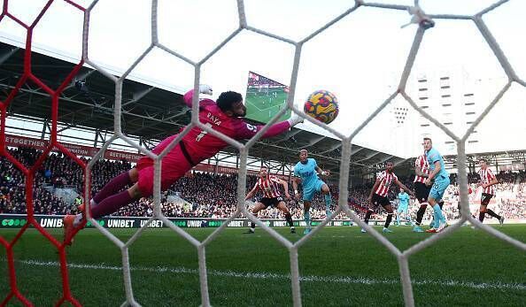 Brentford's David Raya can't stop Joelinton's effort during the Premier League match against Newcastle United. Pic: Marc Atkins/Getty Images)