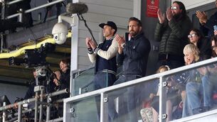 <p>ALMOST UP: Wrexham's owners Ryan Reynolds and Rob McElhenney applaud the teams out on to the pitch during the match against Notts CountyÕs during the Vanarama National League match at the Racecourse Ground, Wrexham. Picture date: Monday April 10, 2023. PA Photo. See PA story SOCCER Wrexham. Photo credit: Barrington Coombs/PA Wire</p>