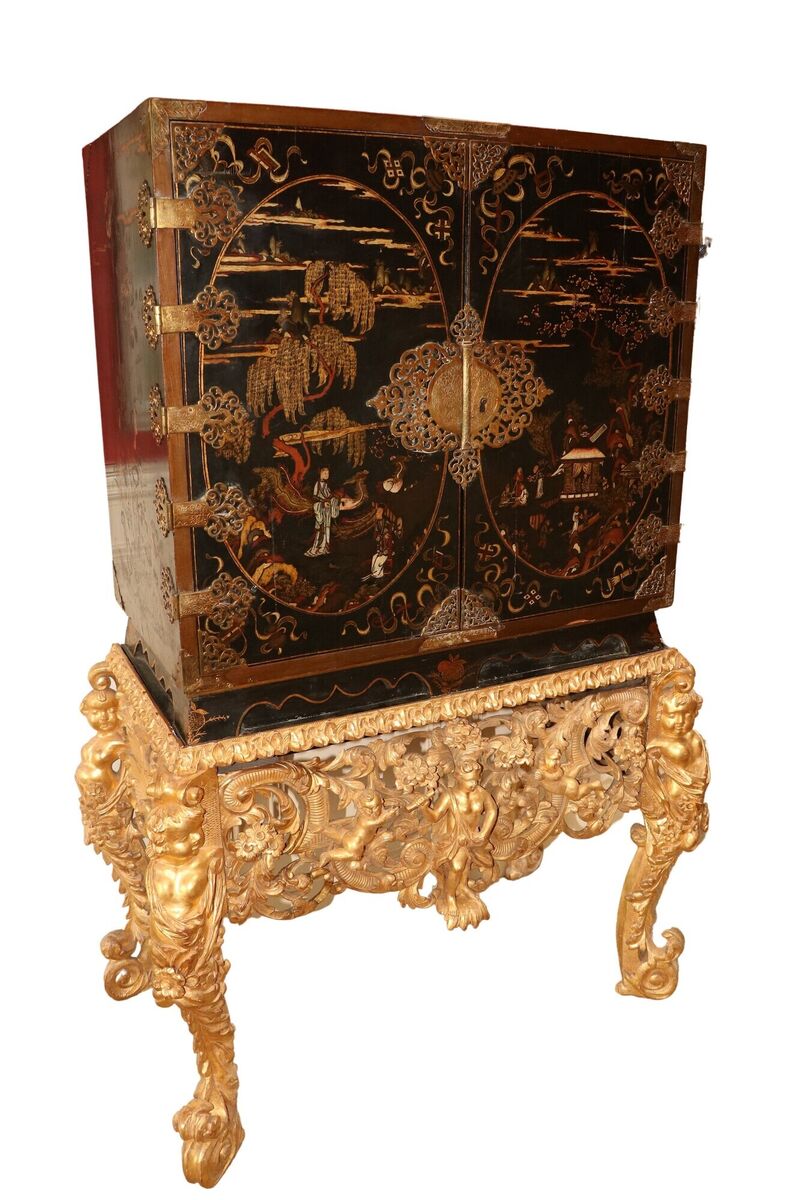 An 18th-century chinoiserie lacquered cabinet on stand.