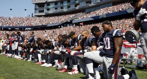 New England Patriots take a knee.
