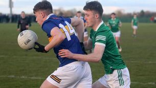 <p>CLOSE QUARTERS: Ronan O'Brien, Tipperary, on the attack against Cian Costelloe, Limerick in the Munster Minor Football Championship in Mick Neville Park, Rathkeale. Pic: Brendan Gleeson</p>