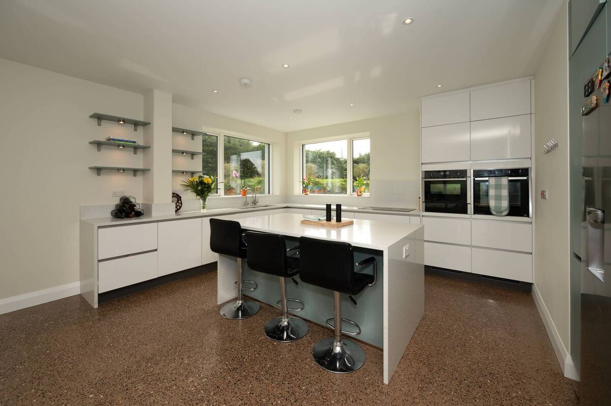 Kitchen with island with power supply and USB charger