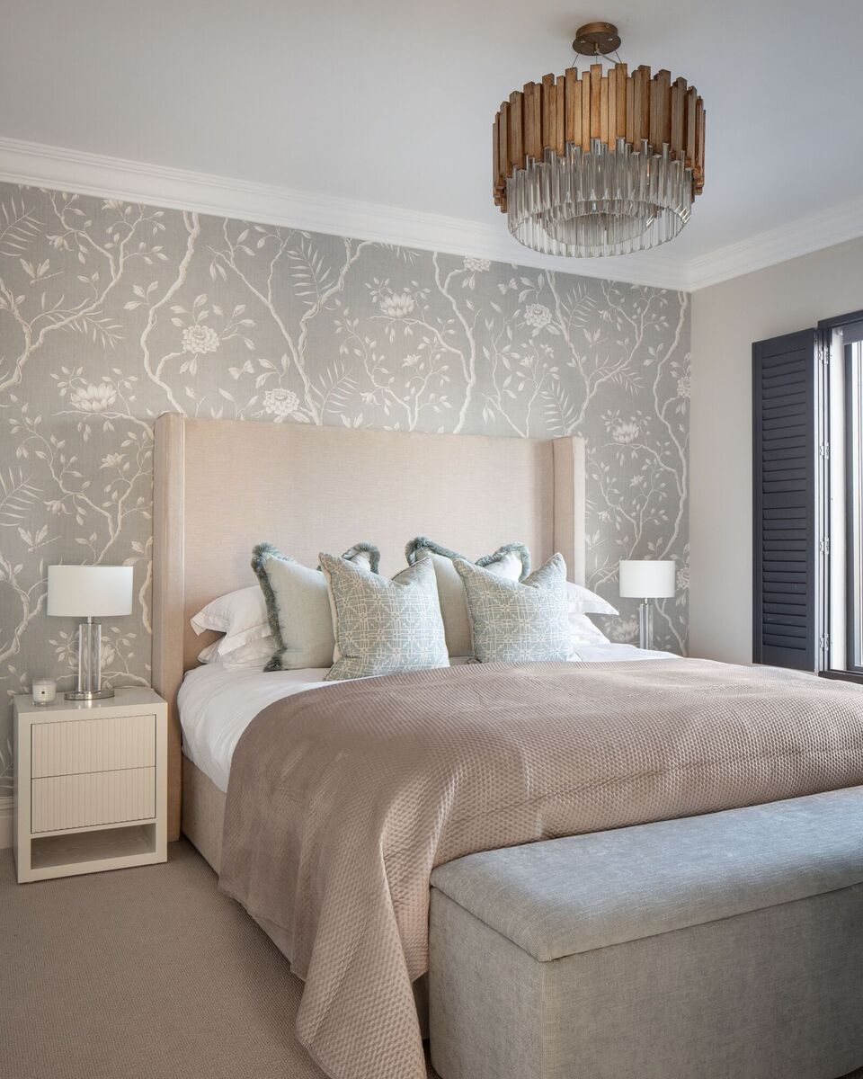  The master bedroom is designed for a clutter-free environment with built-in wardrobes, finished in a restful warm neutral colour palette with soft green in the papered wall.