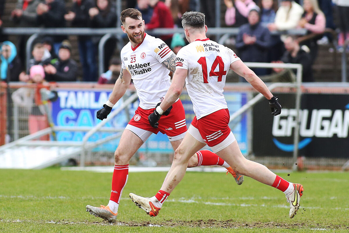 Tyrone's Ronan McNamee is  congratulated by Mattie Donnelly after scoring a point. Pic: ©INPHO/Lorcan Doherty