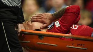 <p>OUT FOR THE SEASON: Manchester United's Lisandro Martinez is carried on stretcher after suffering an injury during the Europa League first leg quarterfinal soccer match between Manchester United and Sevilla at the Old Trafford stadium in Manchester, Thursday, April 13, 2023. (AP Photo/Dave Thompson)</p>