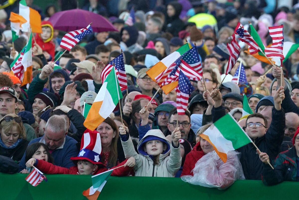 Waving Irish and US flags, tens of thousands of people waited patiently at St Muredach's Cathedral in Ballina, Co Mayo, for US president Joe Biden speech in one of his ancestral Irish hometowns. Picture: Brian Lawless/PA