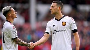 <p>SHAKE ON IT: Diogo Dalot and Antony shake hands after the defender put United 2-0 up away to Nottingham Forest. Nick Potts/PA Wire</p>