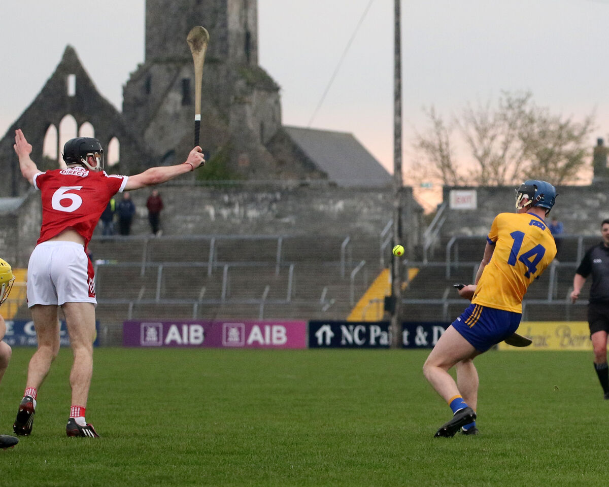  Clare v Cork in the Munster U20 Hurling Match. Senan Dunfoird, Clare, trying to clear the sliotar against Eoin Downey, Cork in the Munster U20 Hurling Match 