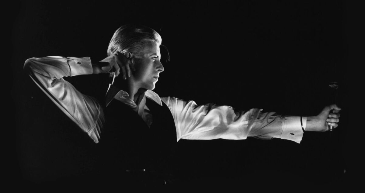 David Bowie performing as The Thin White Duke on the Station to Station tour, 1976. Photograph by John Robert Rowlands. David Bowie performing as The Thin White Duke on the Station to Station tour, 1976. Photograph by John Robert Rowlands.