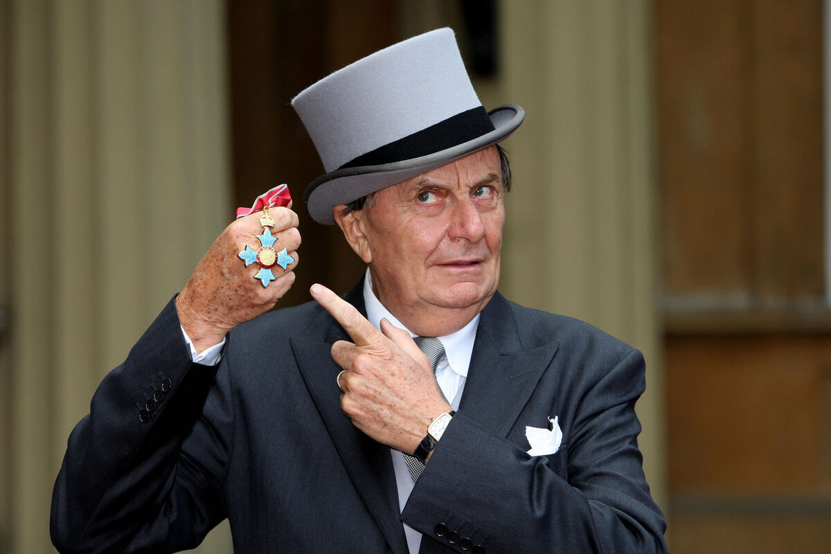 Dr Barry Humphries after he received his OBE (Officer of the Order of the British Empire) from the Queen at Buckingham Palace, London.