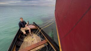 <p>Eoin Warner, host of Ireland's Wild Islands, aboard a Galway Hooker</p>