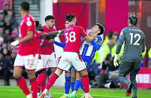 Nottingham Forest’s Felipe pushes JulioEncisco astempers flarelast night. 	Pic: Tim Goode/PA
            