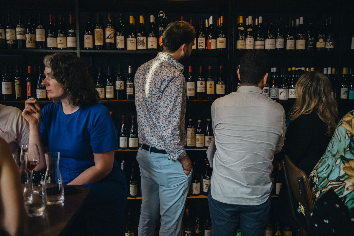 Browsing the shelf at MacCurtain Wine Cellar, MacCurtain Street, Cork Browsing the shelf at MacCurtain Wine Cellar, MacCurtain Street, Cork