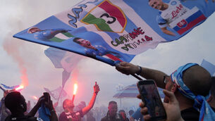 <p>Napoli fans celebrates on the street after their team scored the first goal during the Serie A soccer match between Napoli and Salernitana at the Diego Armando Maradona stadium, in Naples, Italy, Sunday, April 30, 2023. (AP Photo/Gregorio Borgia)</p>