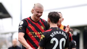<p>Erling Haaland of Manchester City celebrates with Bernardo Silva after victory in the Premier League match between Fulham FC and Manchester City at Craven Cottage on April 30, 2023 in London, England. (Photo by Richard Heathcote/Getty Images)</p>