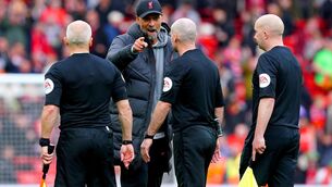 <p>OVER THE TOP: Liverpool manager Jurgen Klopp speaks to match officials at the end of the Premier League match at Anfield. Pic: PA</p>
