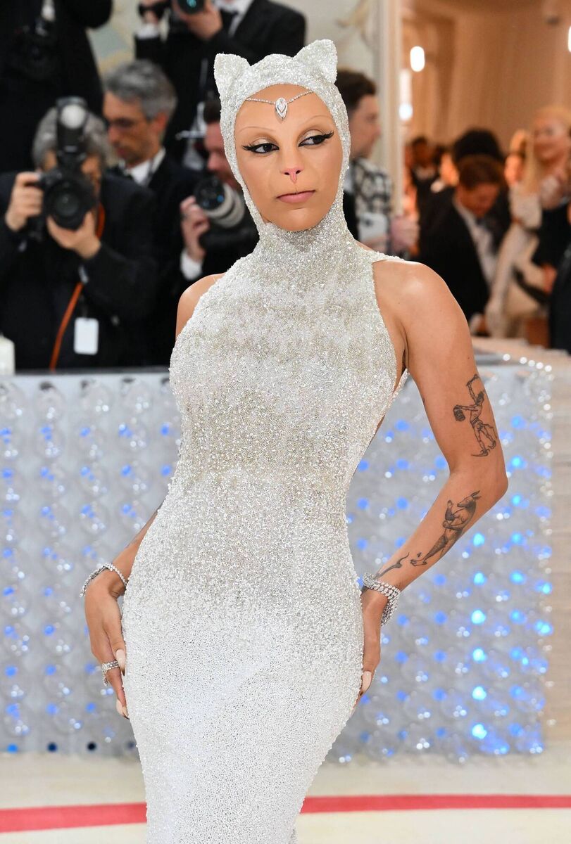 GET MEOWT OF HERE: Rapper Doja Cat lived up to her name and the Met Gala theme with cat prosthetics, and replying to Vogue's questions with a terse 'Meow'. Picture: Angela Weiss/AFP/Getty GET MEOWT OF HERE: Rapper Doja Cat lived up to her name and the Met Gala theme with cat prosthetics, and replying to Vogue's questions with a terse 'Meow'. Picture: Angela Weiss/AFP/Getty