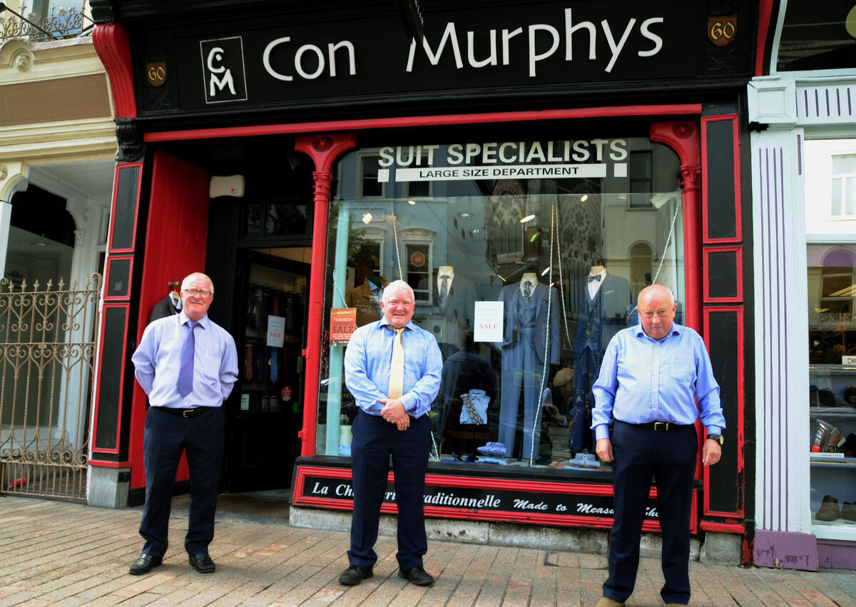 Neil Murphy, owner, (centre) with staff members Mick Kelly (left) and Donie Walsh, outside Con Murphy Menswear, St. Patrick's St., Cork. Picture Denis Minihane.